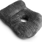 A dark gray plush lumbar pillow with a textured wavy pattern, shown on a clean white background.