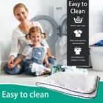 A quilted white mattress topper with a dark gray border is shown in the foreground, with a woman and child sitting in front of a washing machine in the background. Text overlays read 'Easy to Clean' with icons indicating wash and dry care instructions.